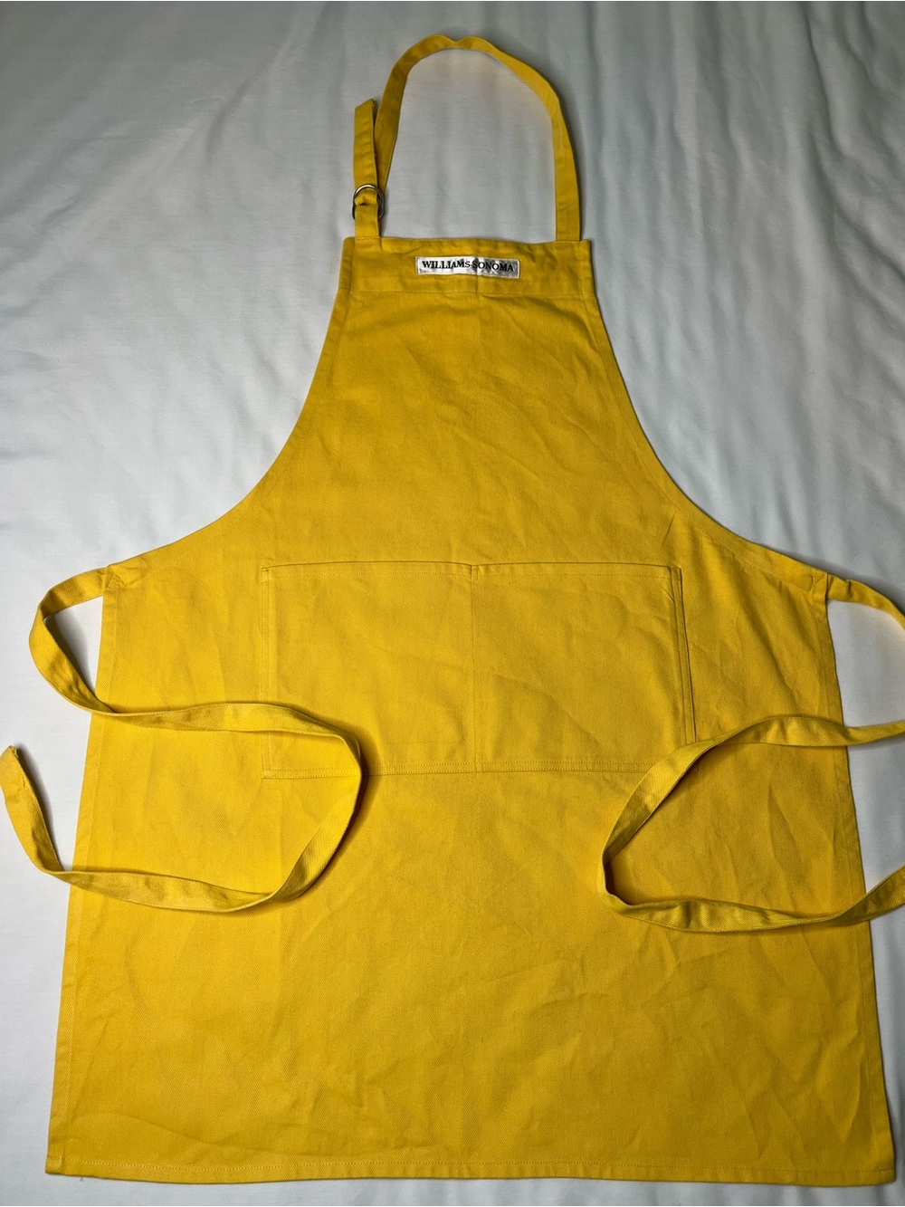 William Sonoma Vibrant Yellow Cotton Bib Apron W/ Adj Strap & Dual Pockets.